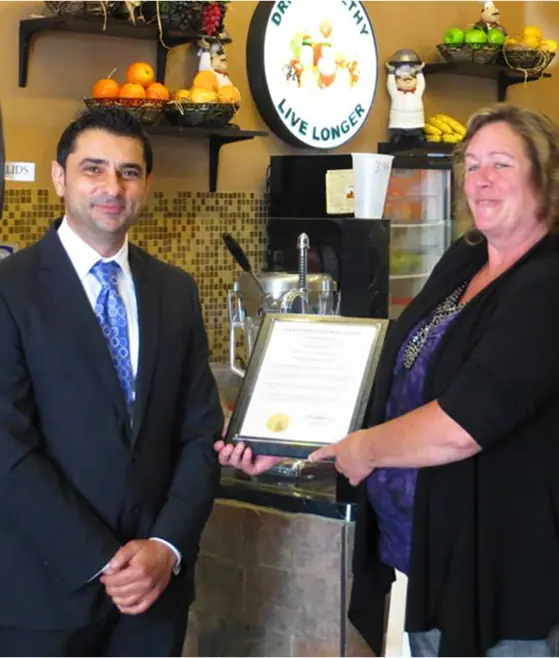 Accepting a community recognition from local officials