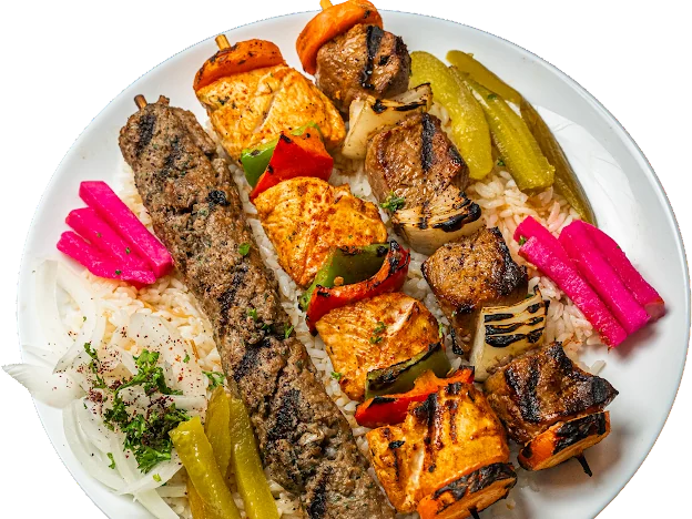Chicken, meat and kafta kabob skewers over rice