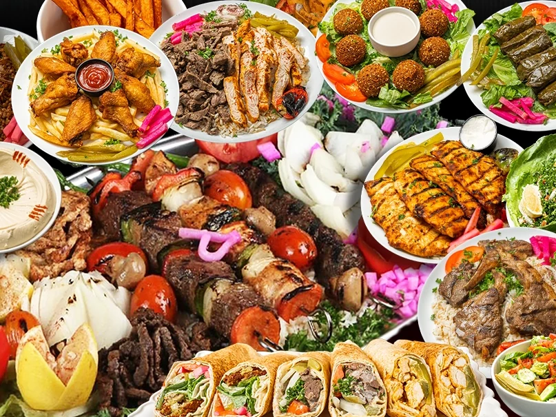 Catering spread of kabobs, wraps, salads and sides